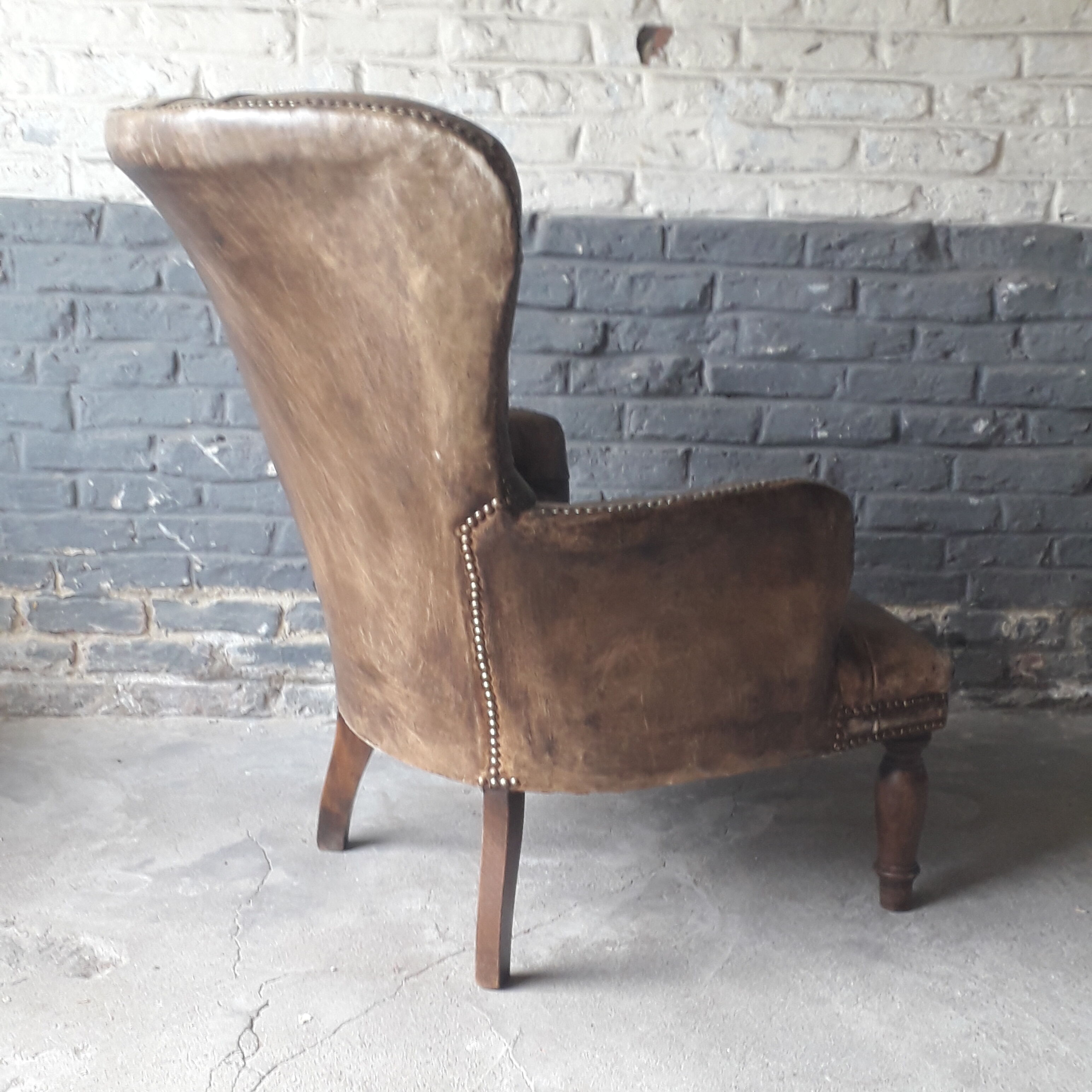 Fauteuil Chesterfield antique