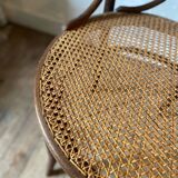 Cane and curved wood armchair