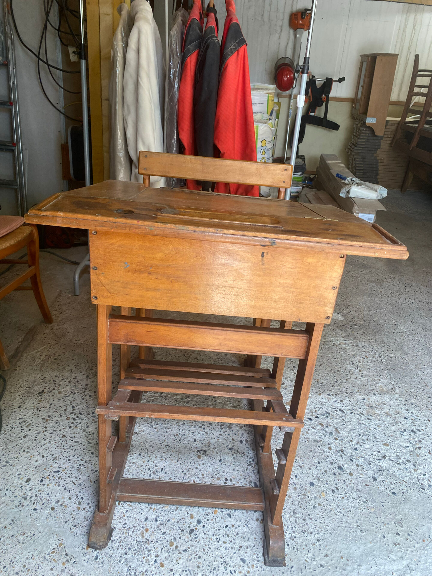 Old school desk with integrated adjustable seat.
