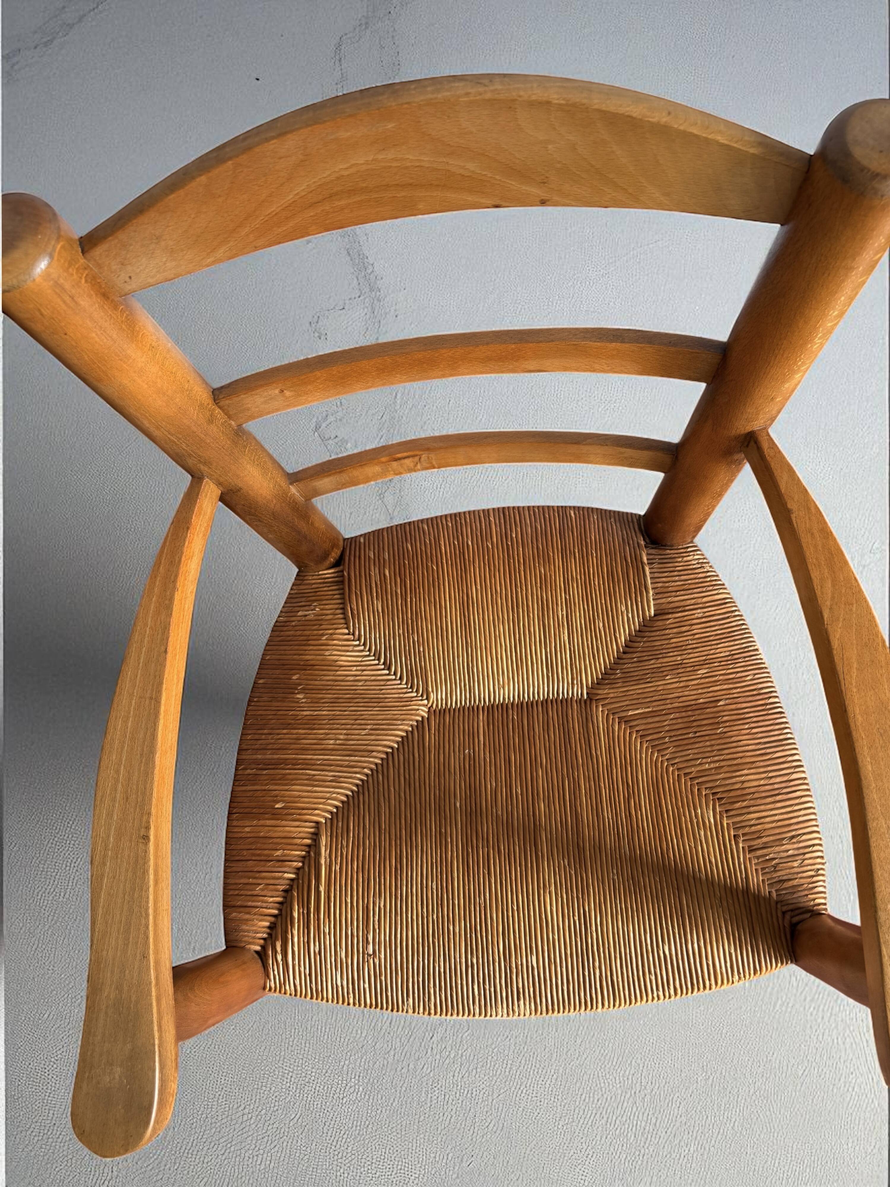 Pair of vintage armchairs in solid wood and straw – Georges Robert