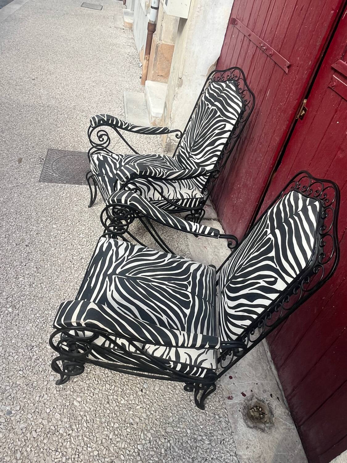 Pair of wrought iron armchairs