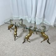 Hollywood Regency style coffee table, 6 patinated brass horses and glass top, 1970.