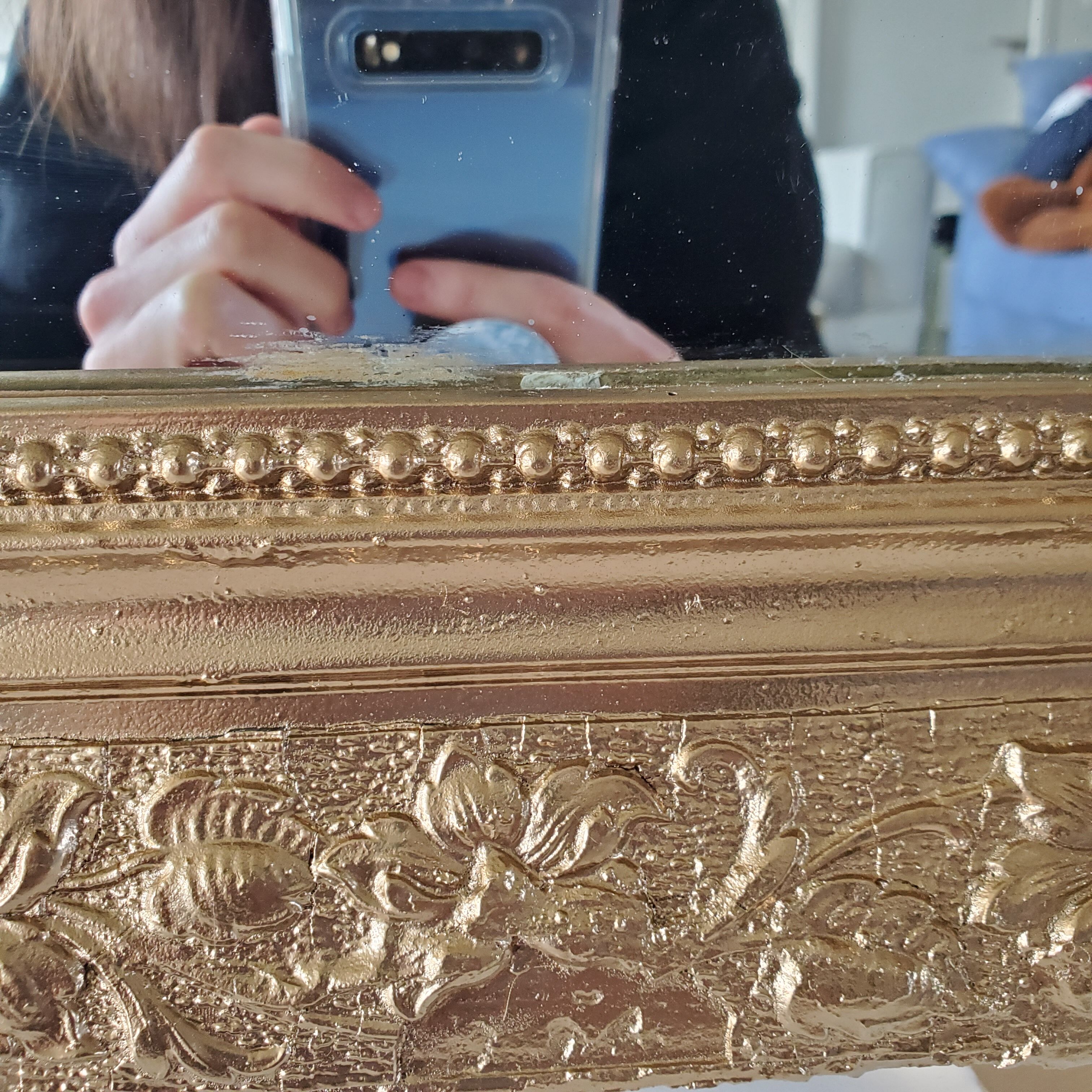 Antique mirror with gilded wood crests