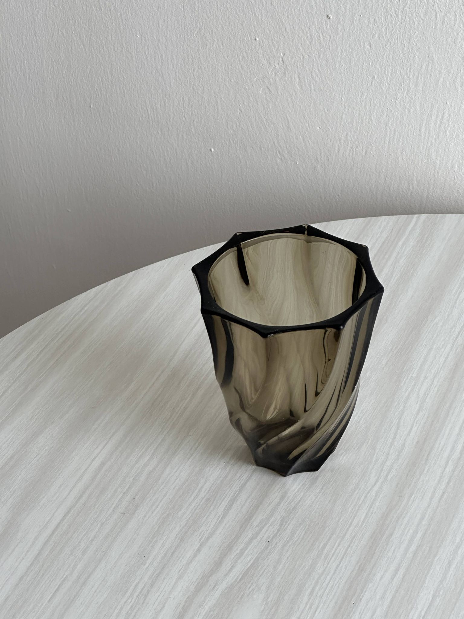 Smoked glass vase with twisted design