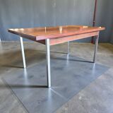 Vintage wooden dining table with chrome frame.