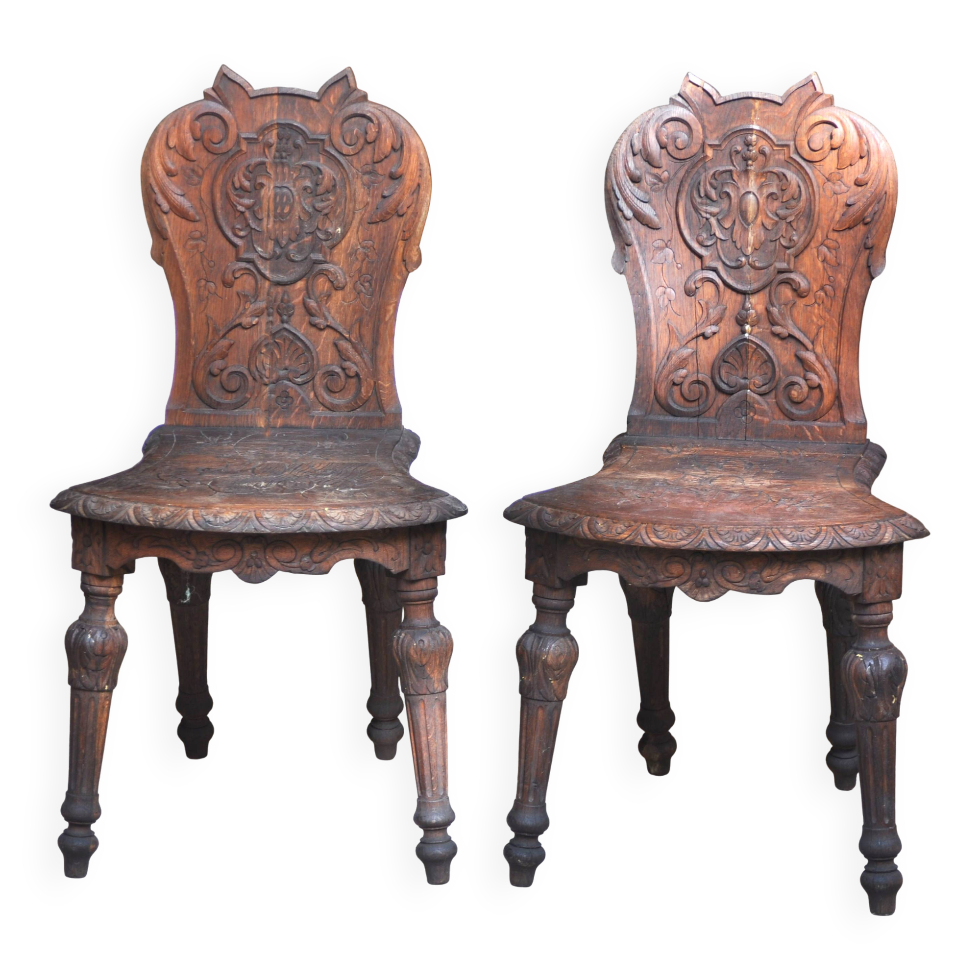 Pair of antique carved wooden chairs