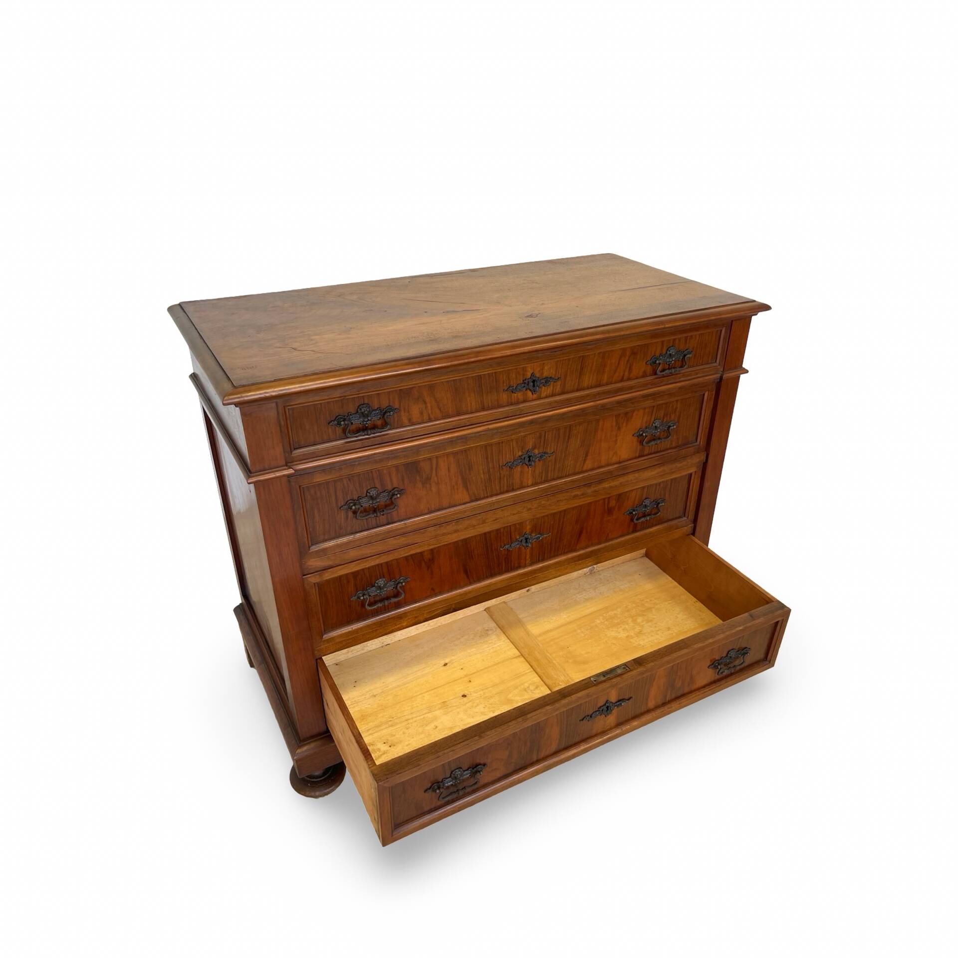 Antique walnut commode with bronze handles in the shape of a lion's mask,