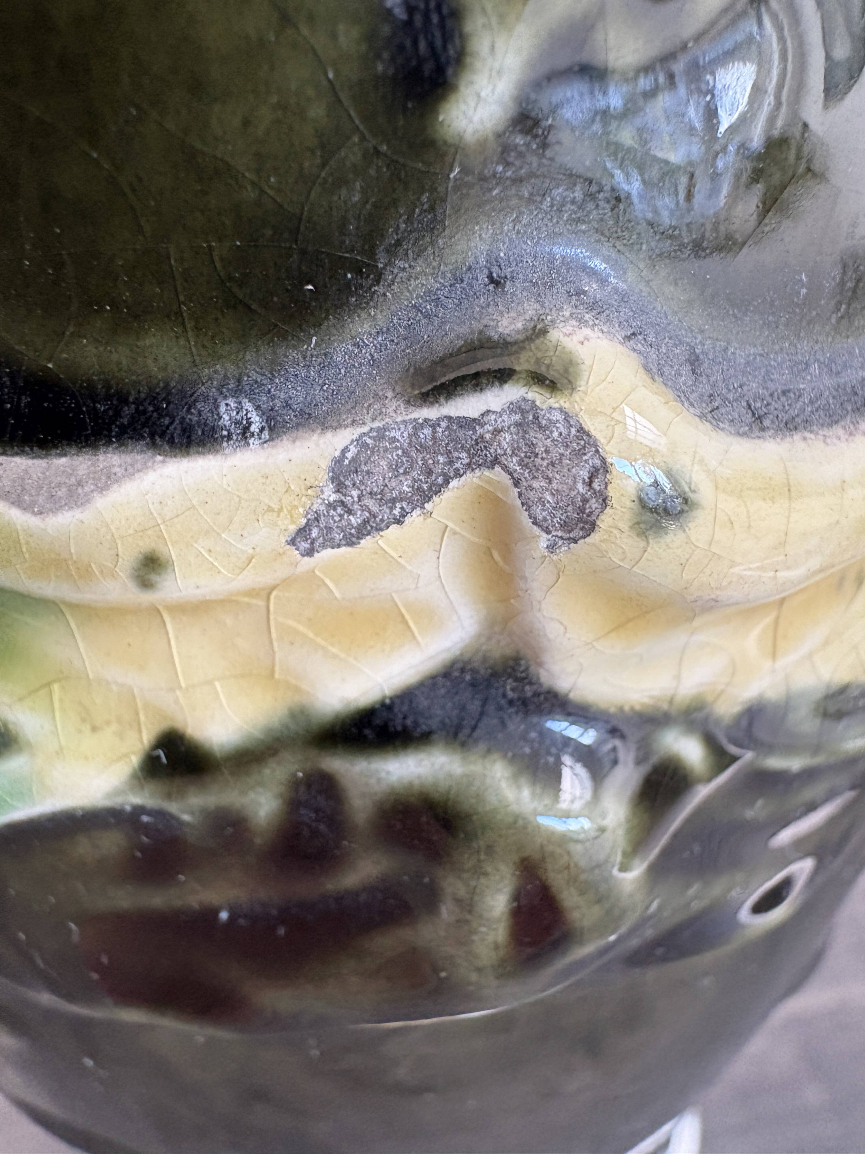 Antique ceramic vase by De Bruyn with floral decoration.