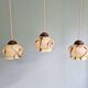 Trio of Art Deco marbled opaline pendant lights, 1920-30