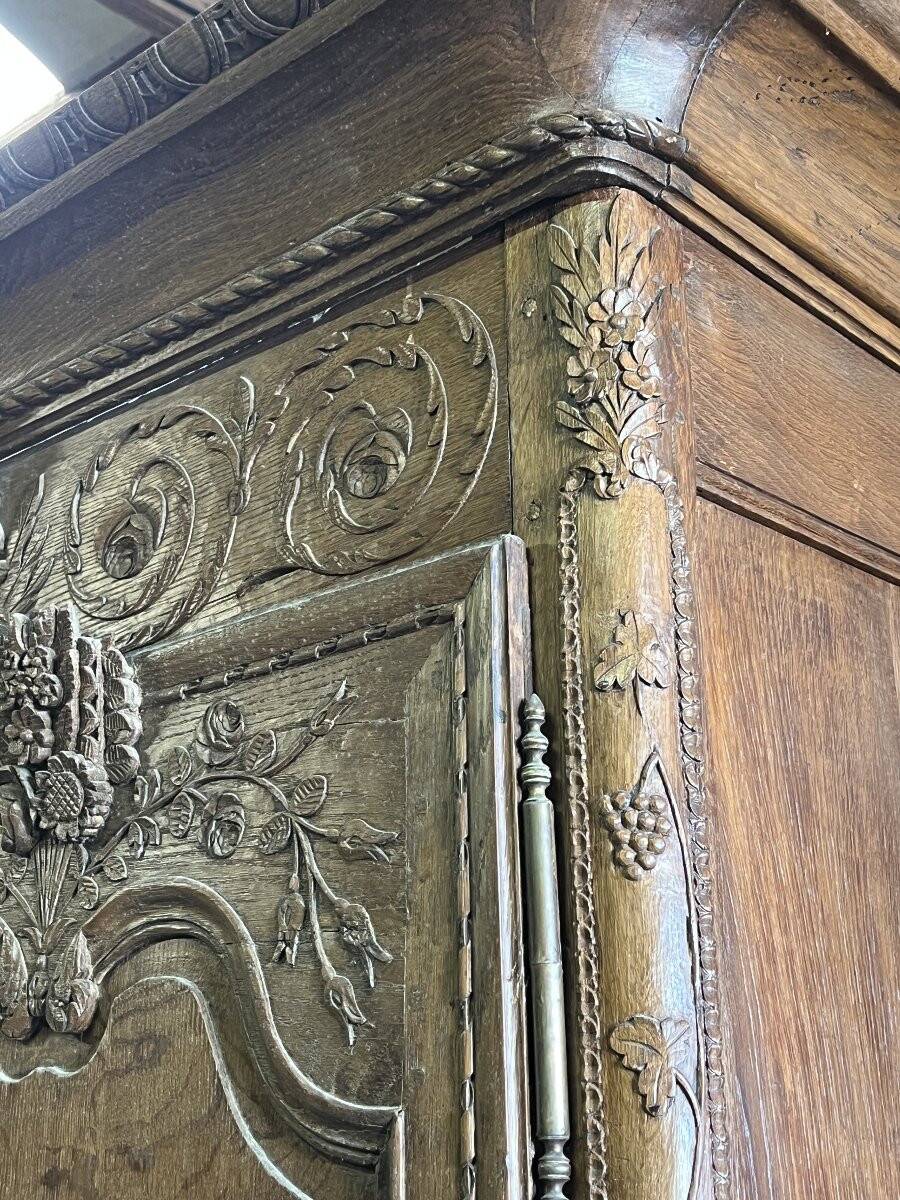 19th-century Norman wedding armoire, with bouquets of flowers and doves.
