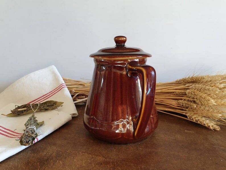 Vintage tea maker in old-fashioned country house-style earthenware