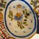 Dish, egg server in hand-painted earthenware, signed Geo Martel