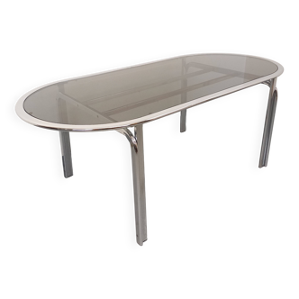Vintage oval dining table in smoked glass and chrome metal, Space Age style.