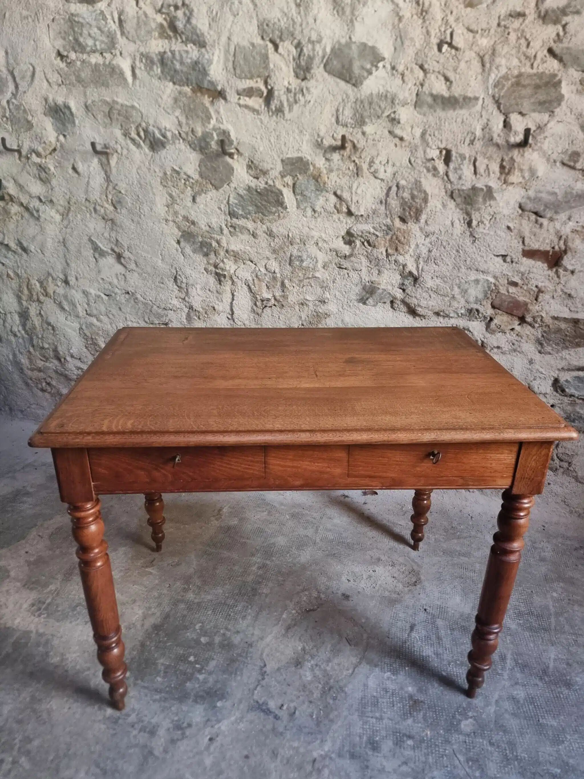 Antique French oak writing desk with 2 lockable drawers, circa 1920.