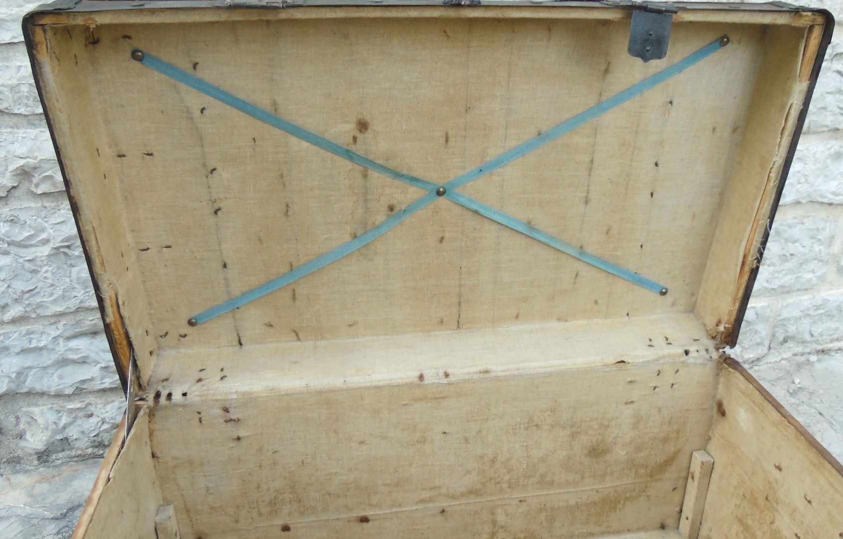 Old wooden and leather trunk, old brass nail trunk and leather strap