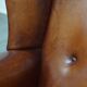 Sheepskin Wingback Chair with Warm Tones and Black Piping