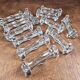 Set of 12 antique knife and fork rests in thick transparent glass.