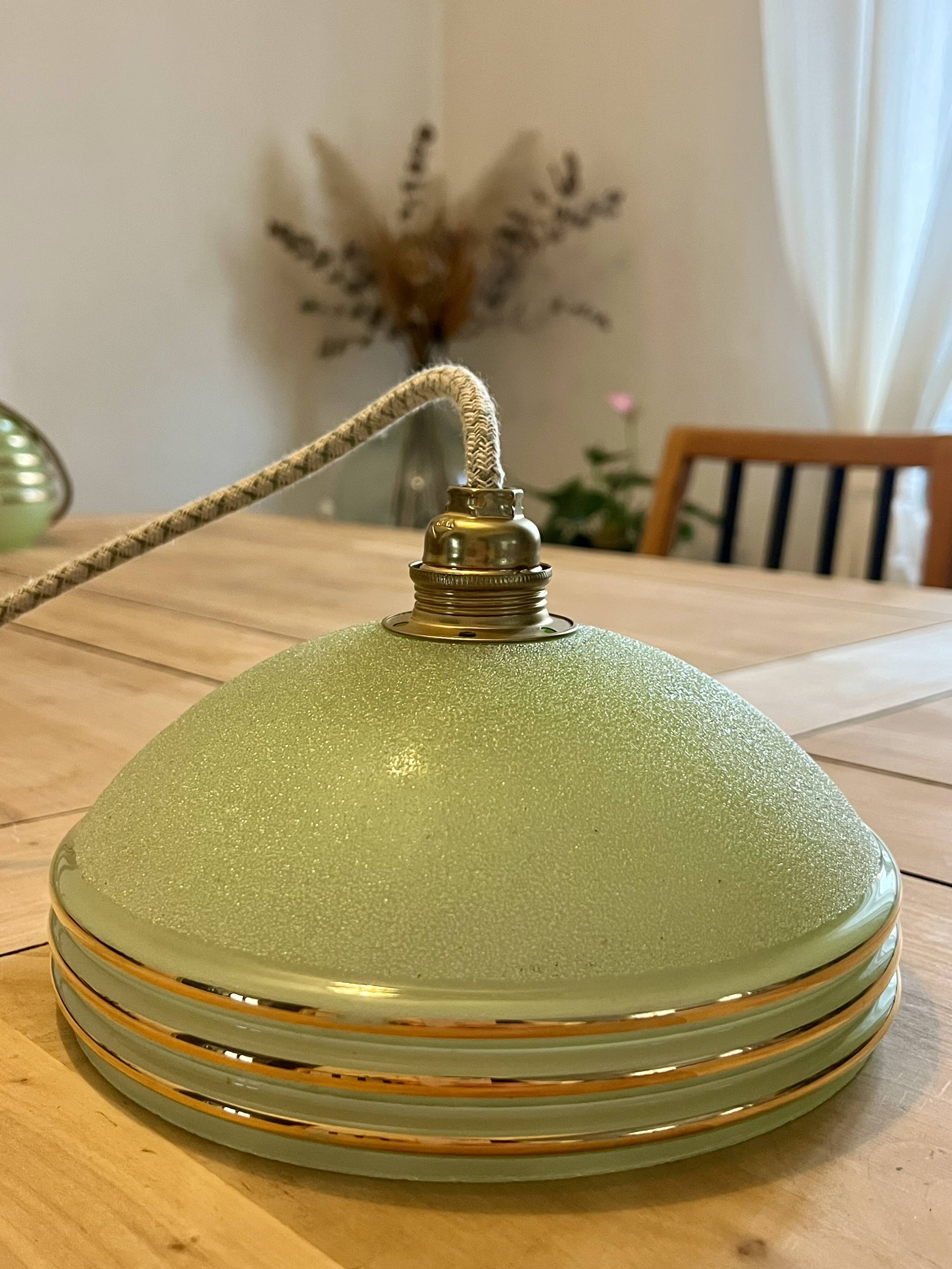 vintage Art Deco suspension in frosted almond green glass with golden trim