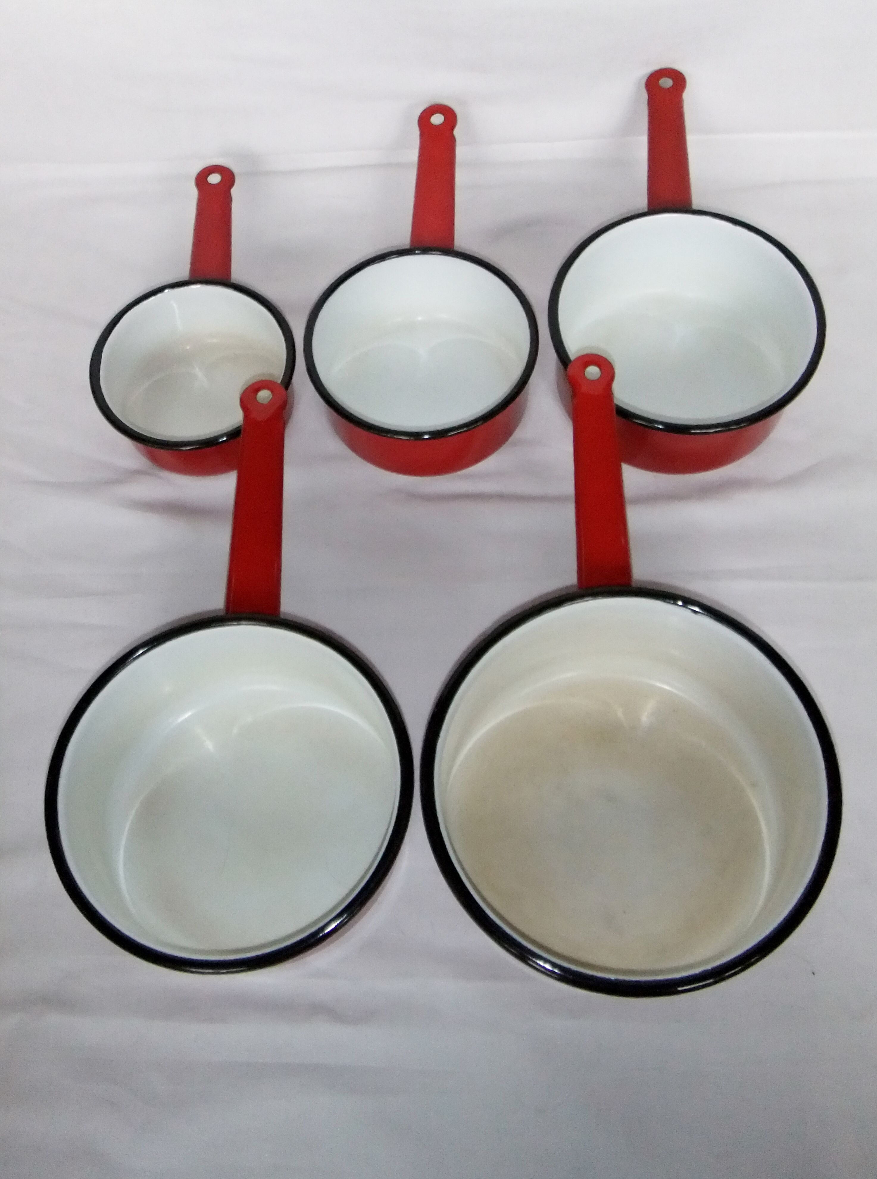 Red enamelled sheet metal pans