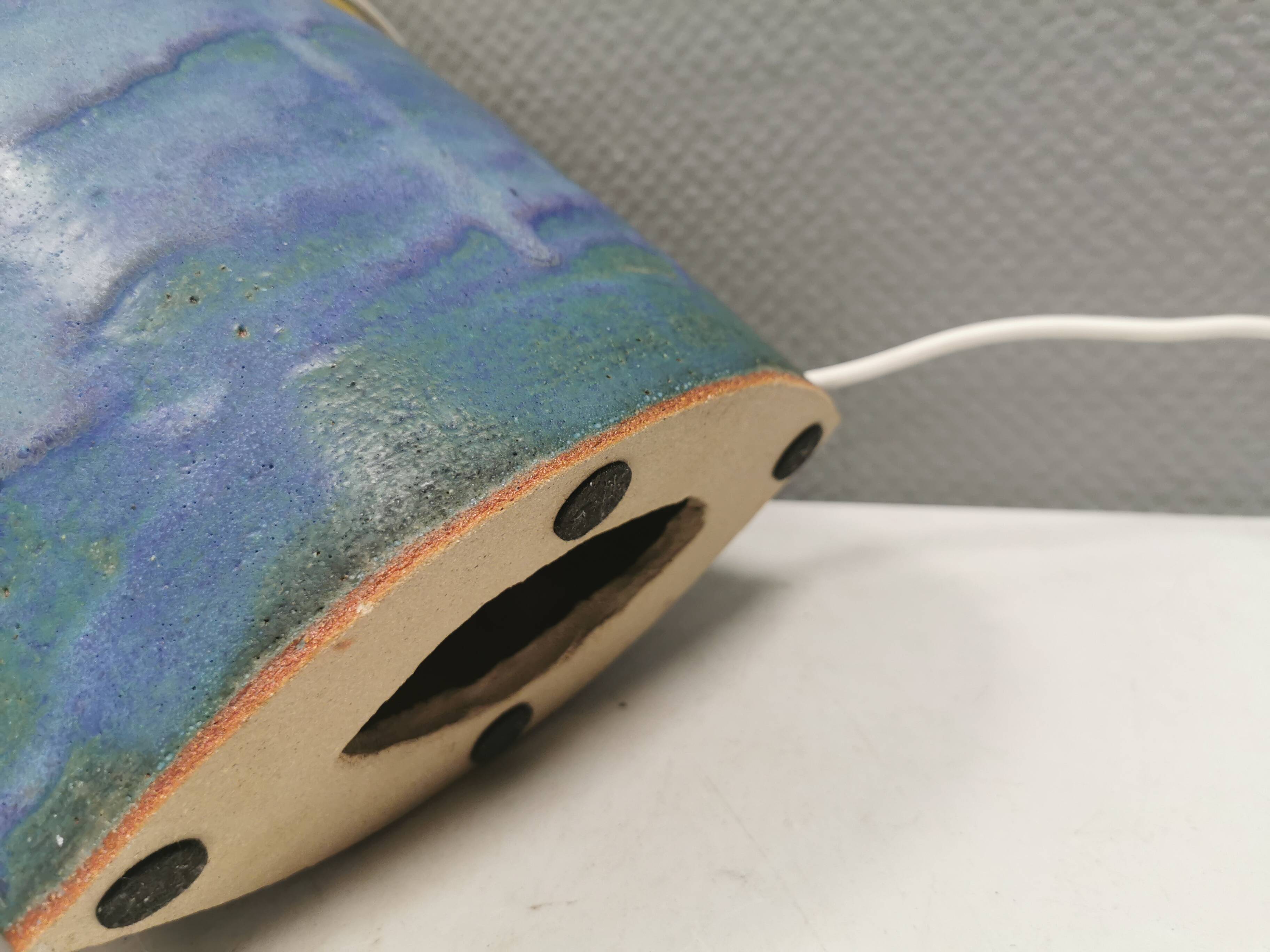 Sculptural table lamp in blue glaze with an abstract expression.