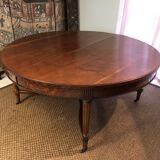Important central pedestal table in mahogany, brass and bronze that can form a large dining table.