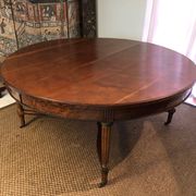 Important central pedestal table in mahogany, brass and bronze that can form a large dining table.