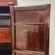 Antique red cabinet with brass details