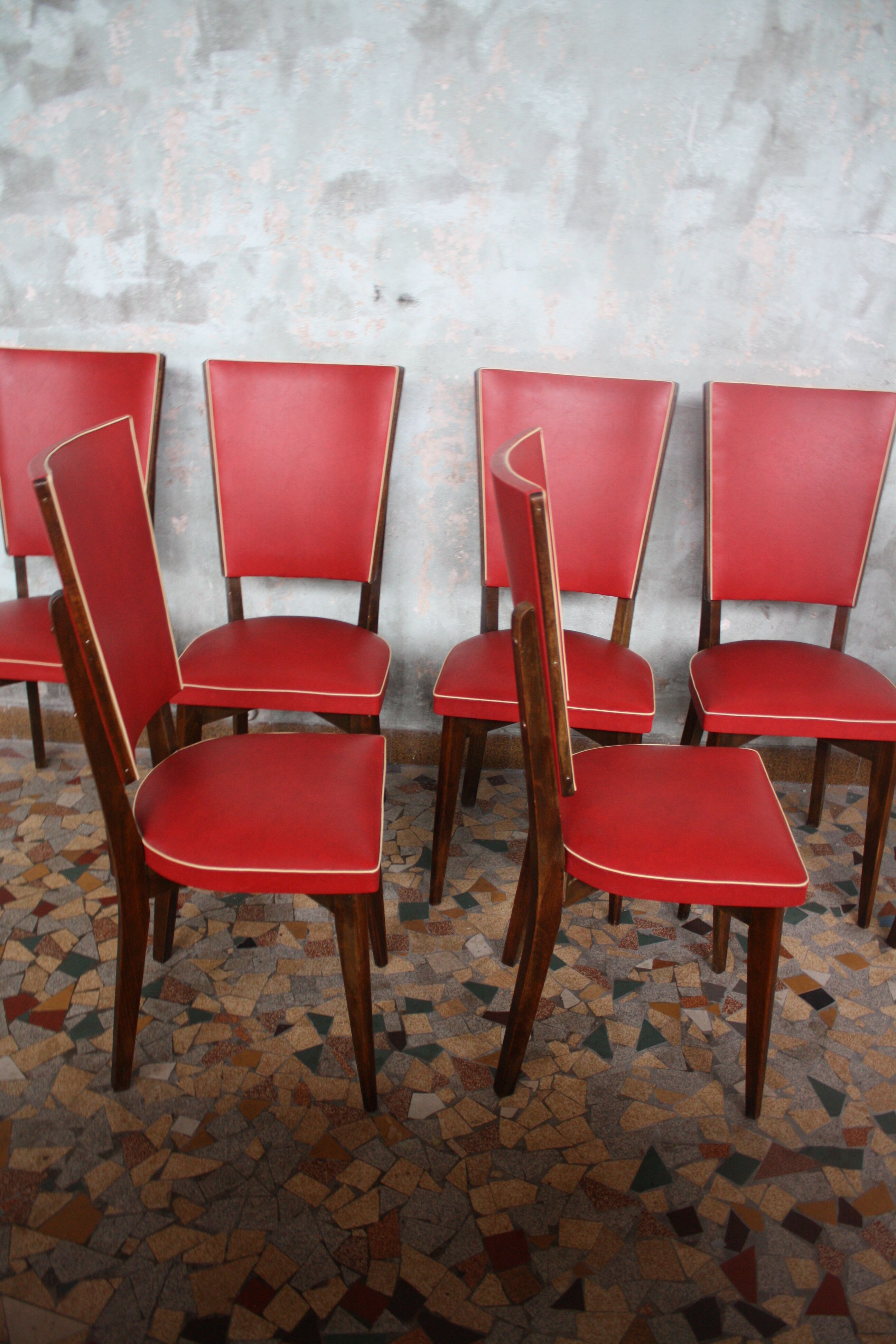 Lot of 8 vintage wooden chairs and red skai