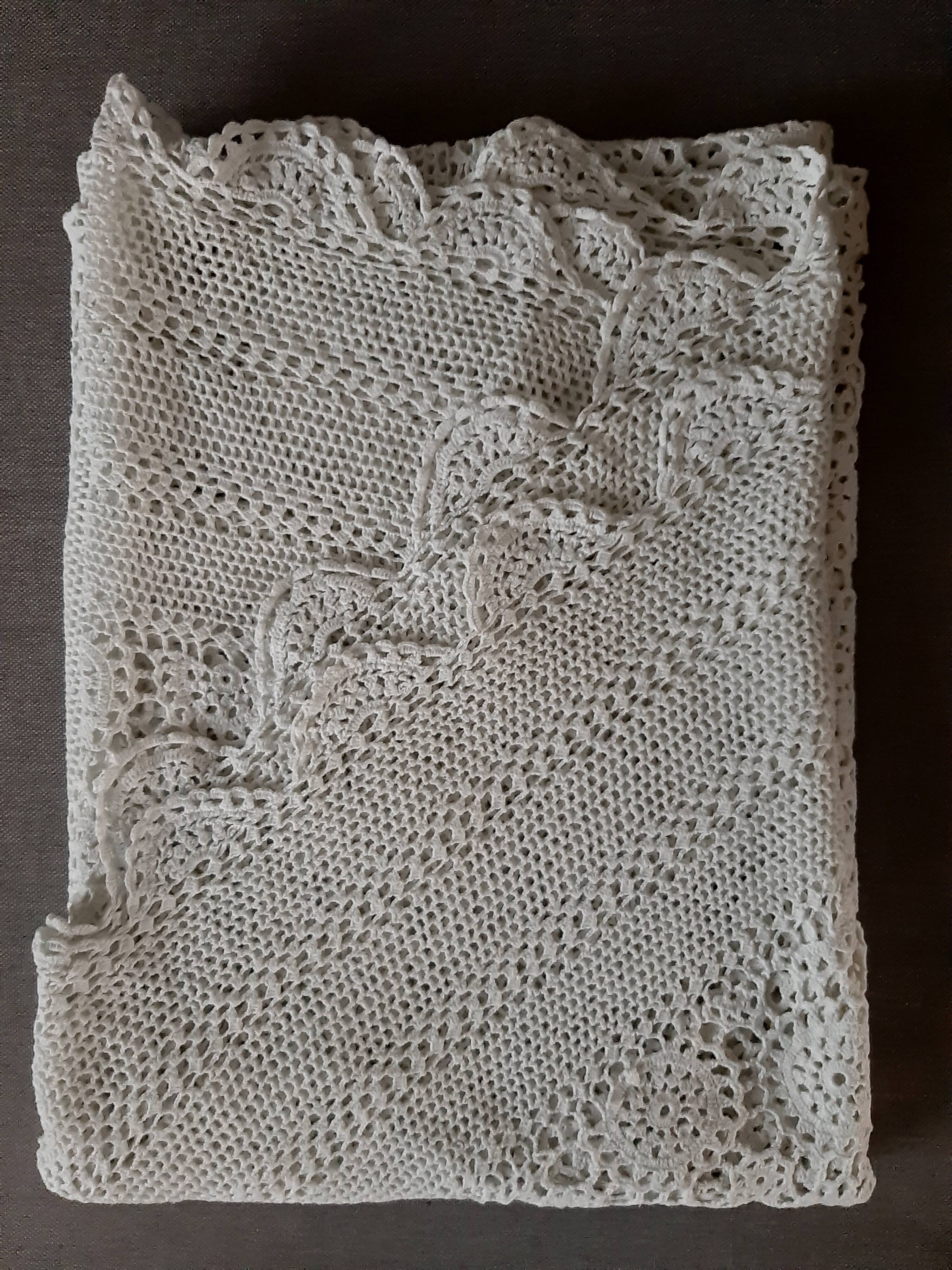 Old crocheted round tablecloth