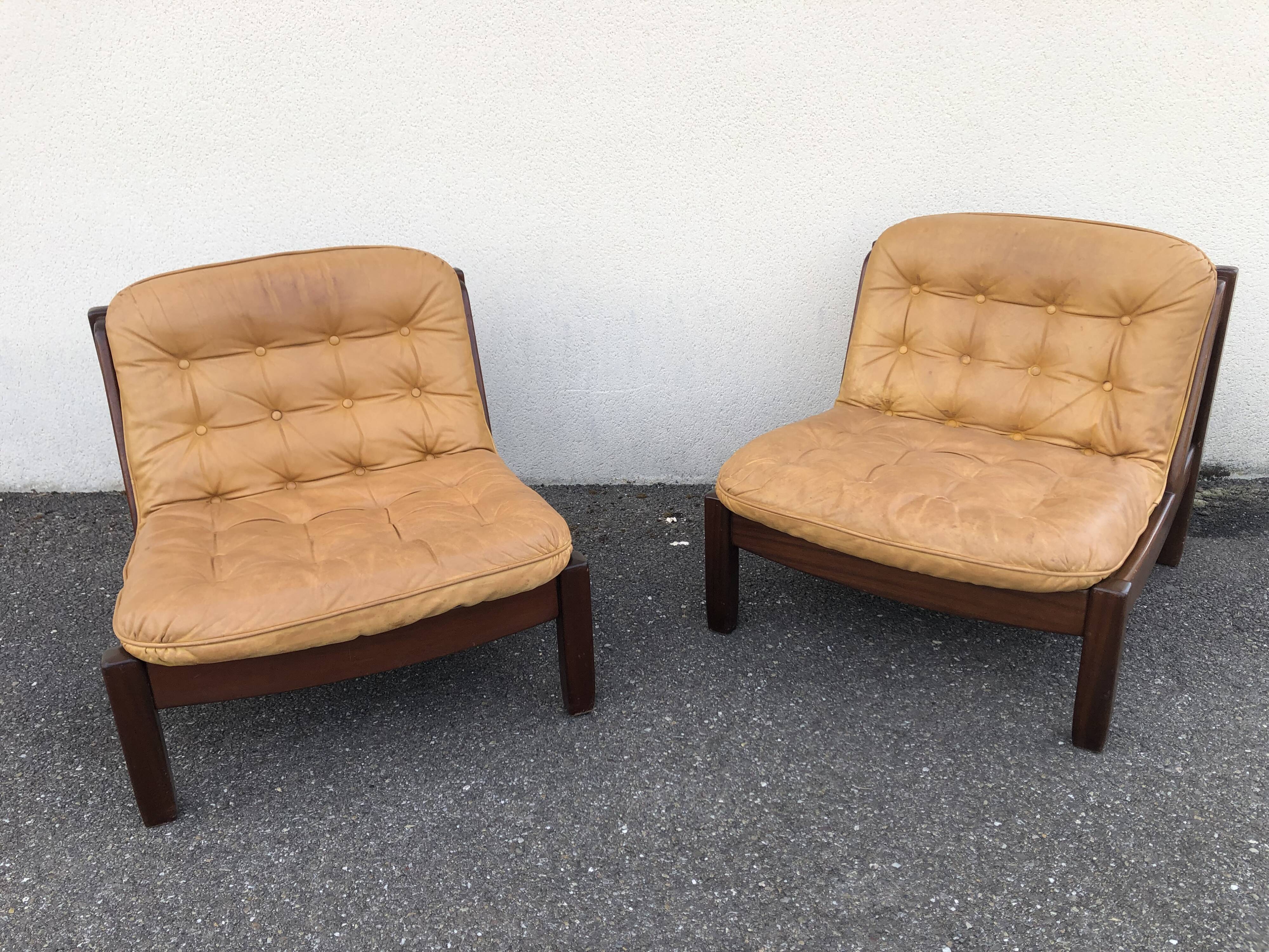 Leather and wood armchairs 70s