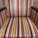 Art Deco armchair in multicolored striped fabric and its footrest