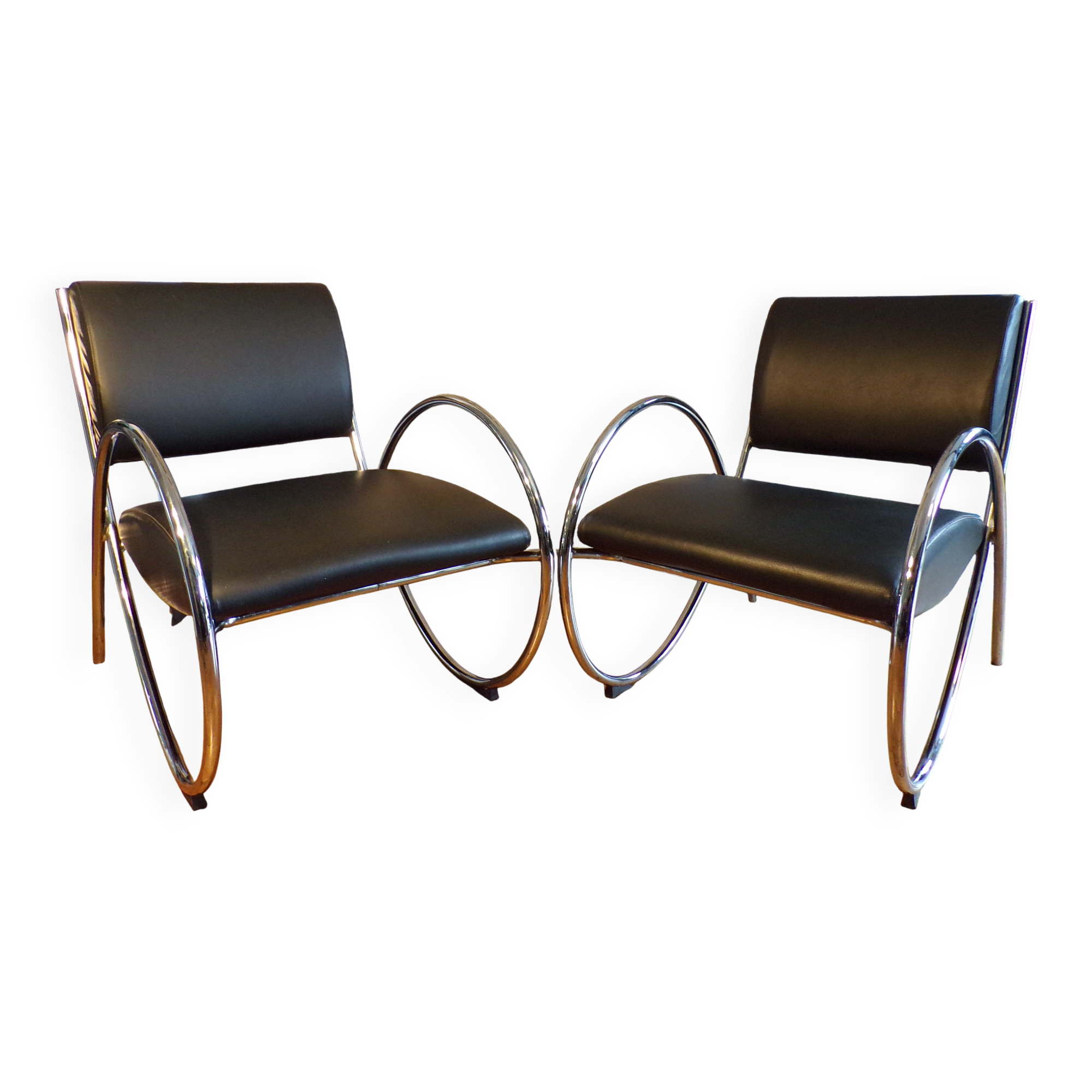 Pair of chrome and faux leather armchairs
