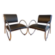 Pair of chrome and faux leather armchairs