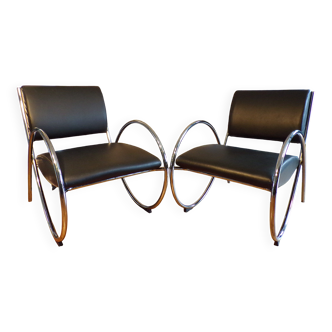 Pair of chrome and faux leather armchairs