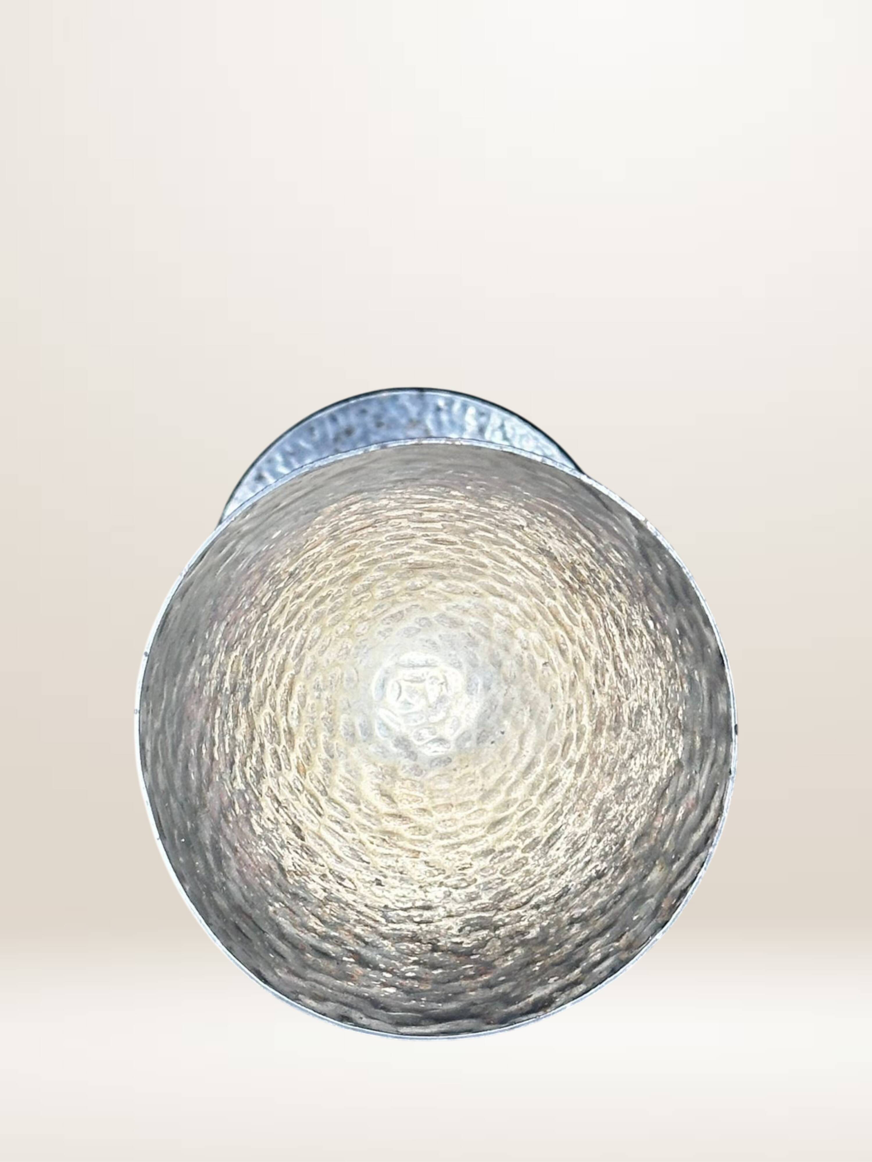 Set of six hammered metal goblets.