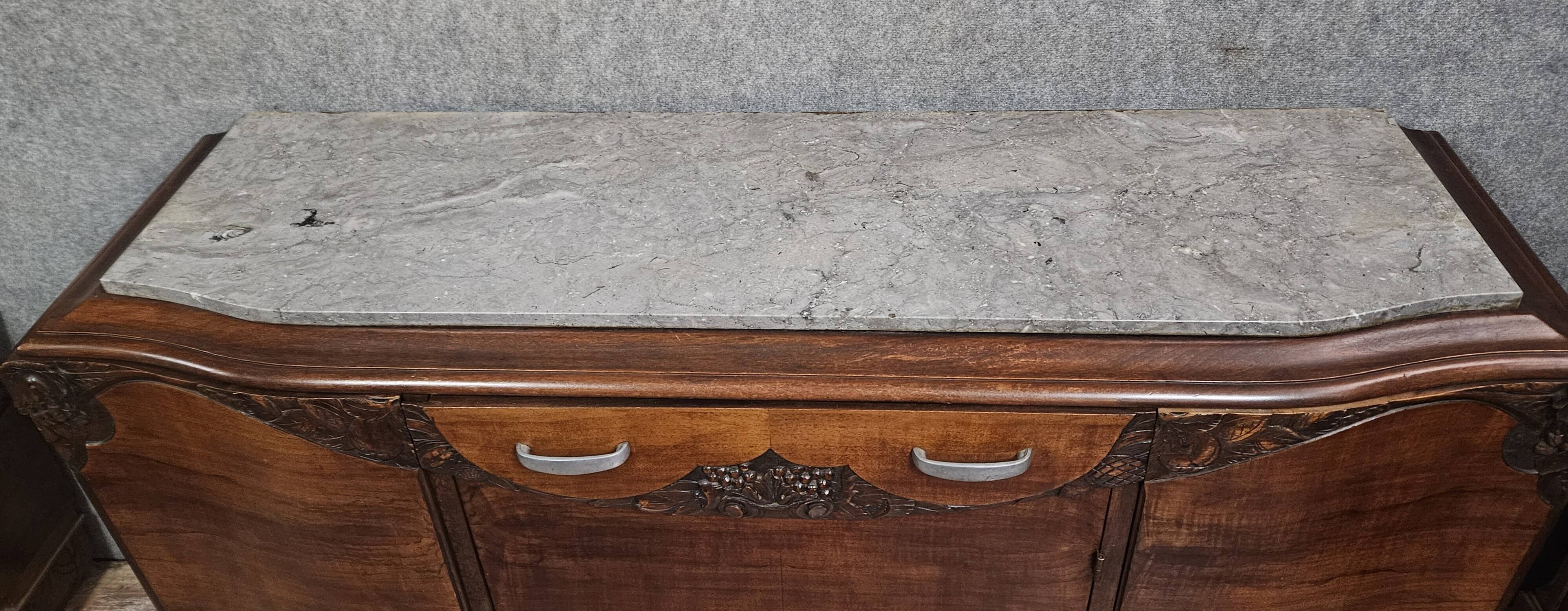 Sideboard in a row, Art Deco period, in mahogany.