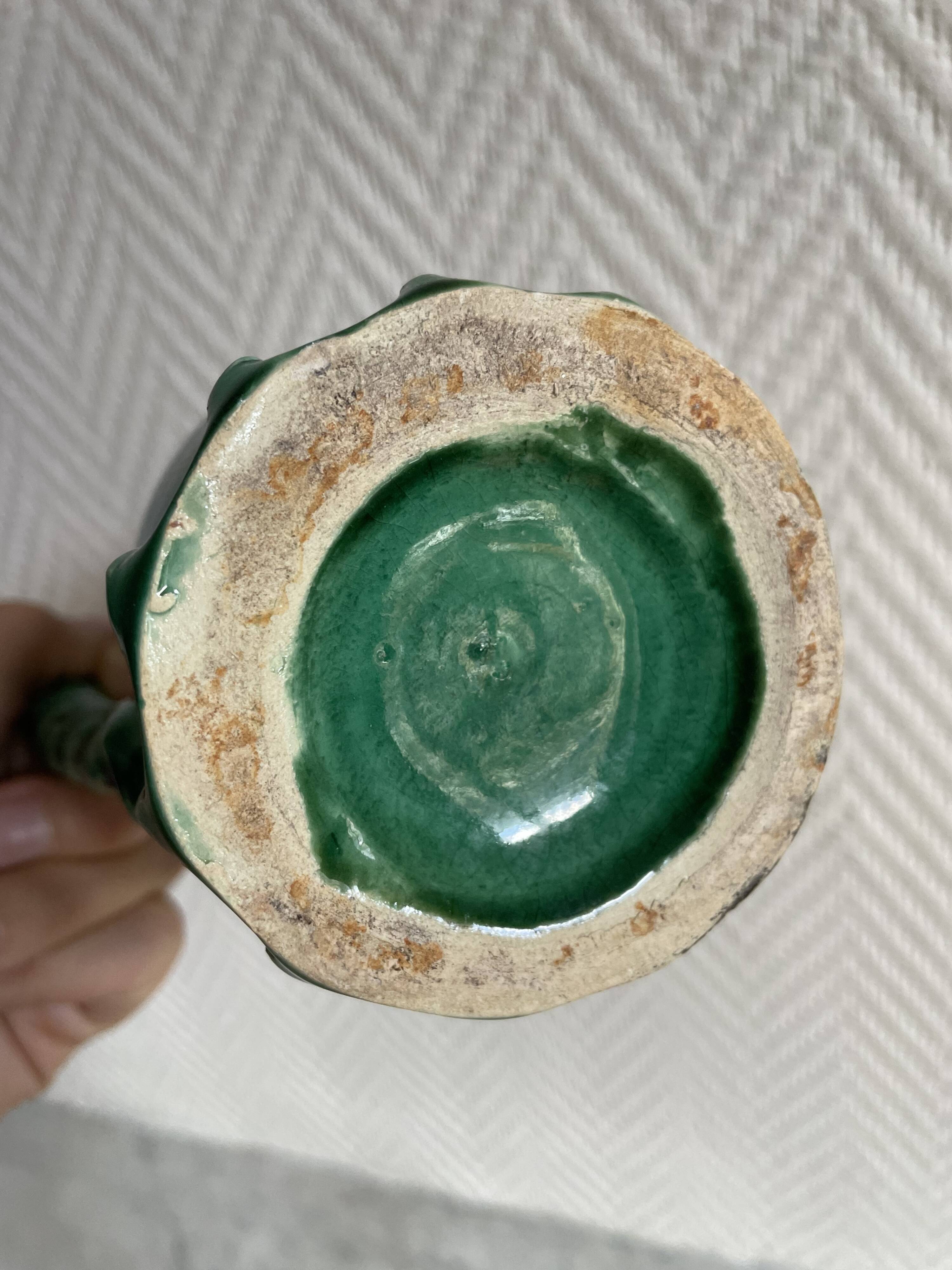 Small green ceramic pitcher