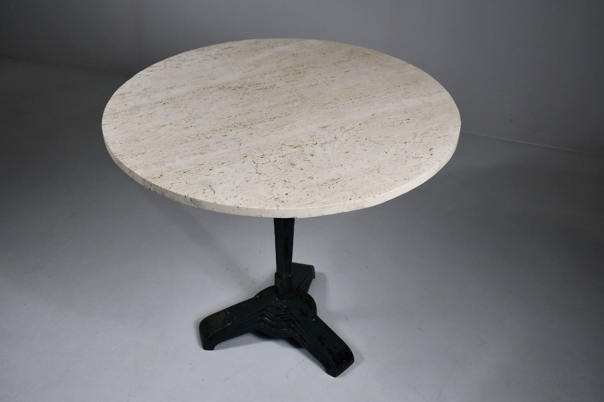 Vintage travertine bistro/dining table with metal base. (B)