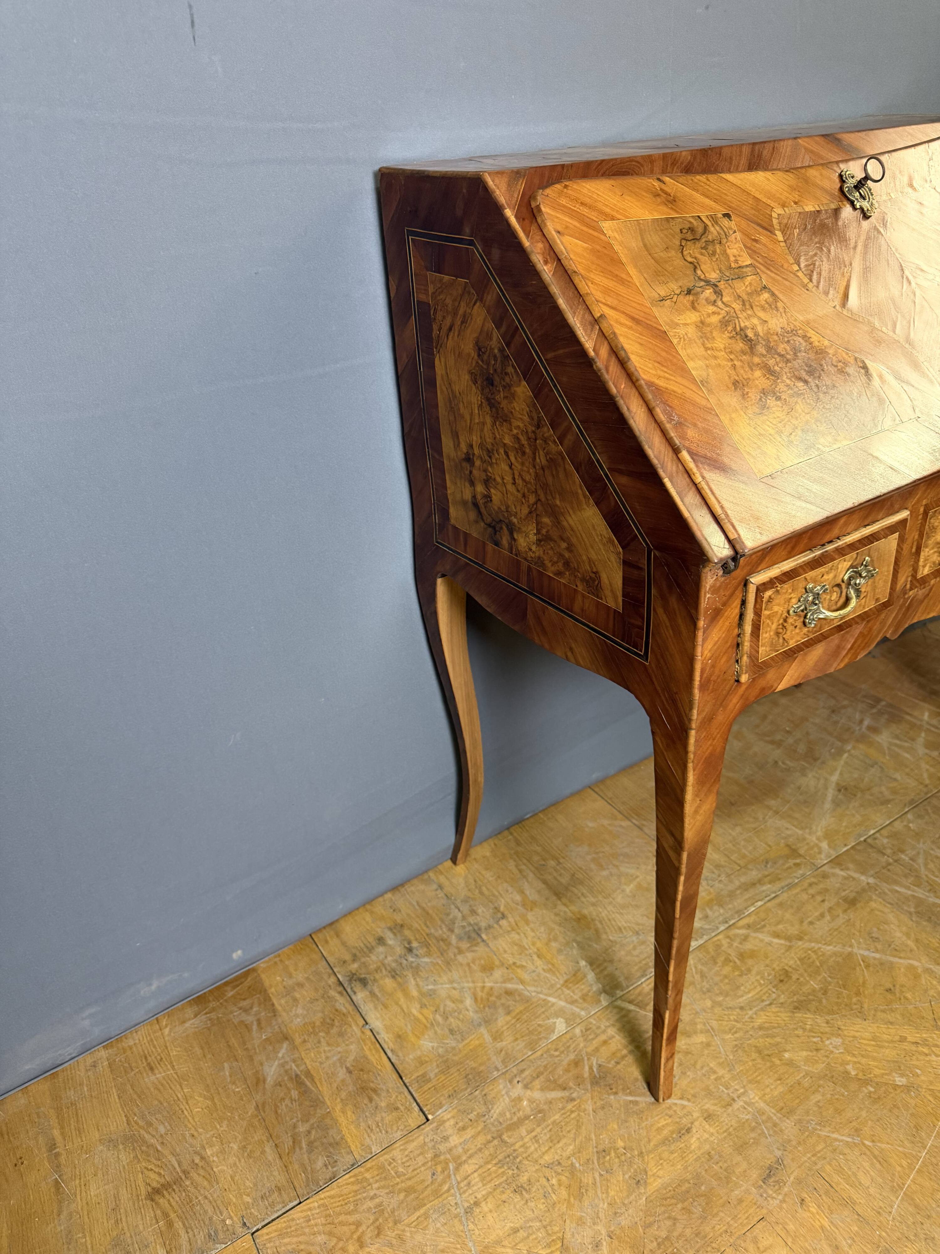Louis XV slant-top desk in 18th-century marquetry.