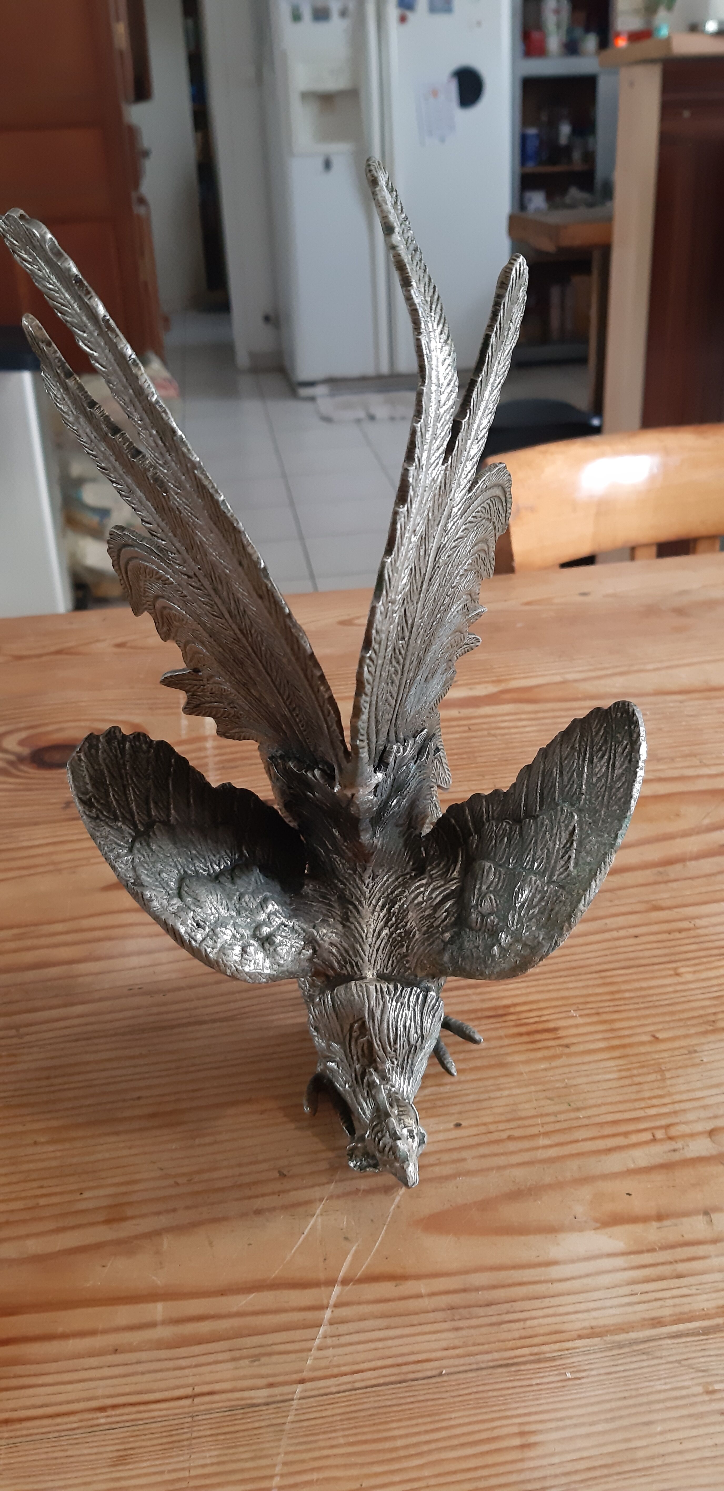 2 silver metal roosters