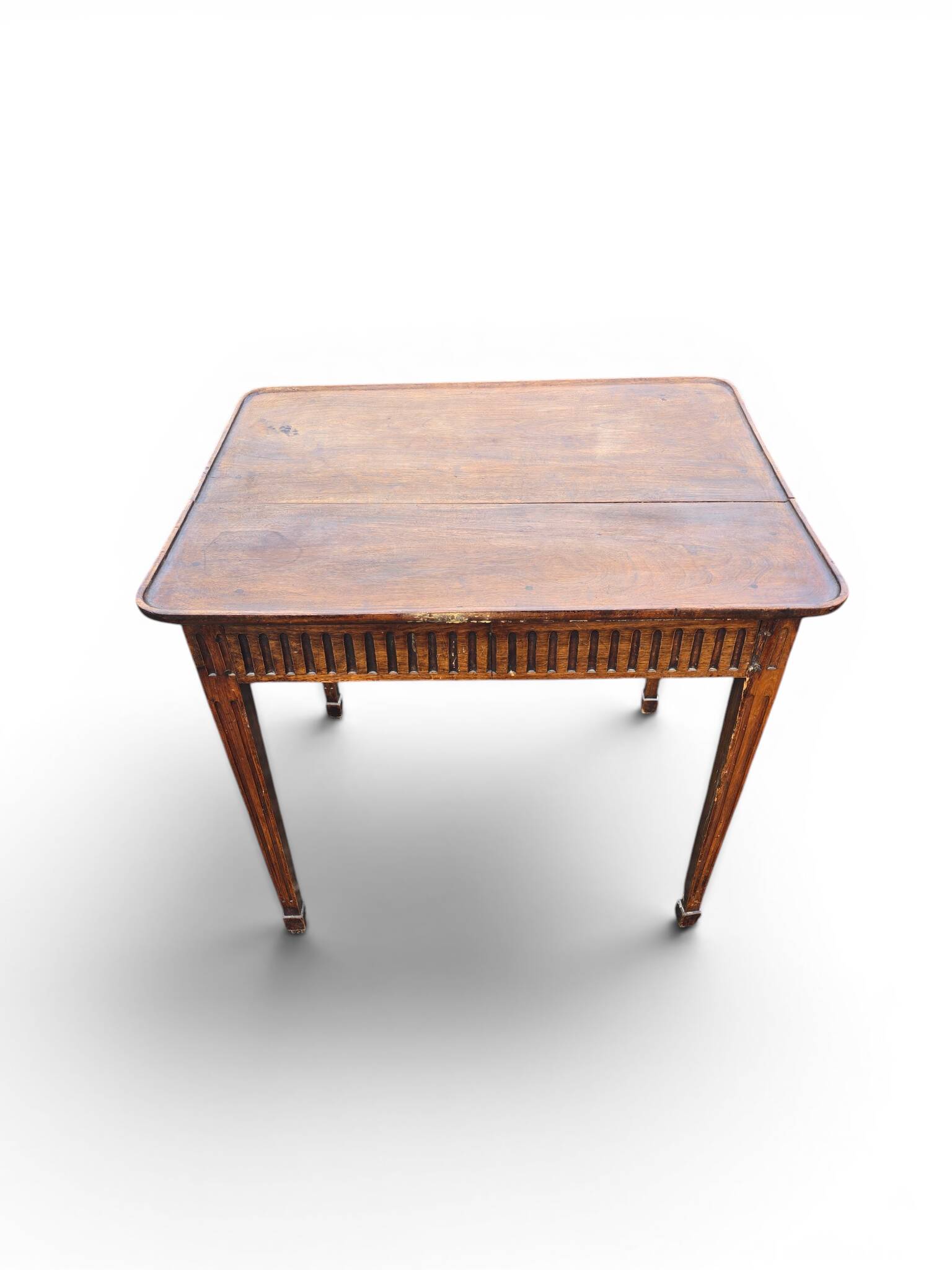 Antique game table in patinated wood in the Louis XVI style.