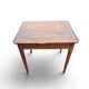 Antique game table in patinated wood in the Louis XVI style.