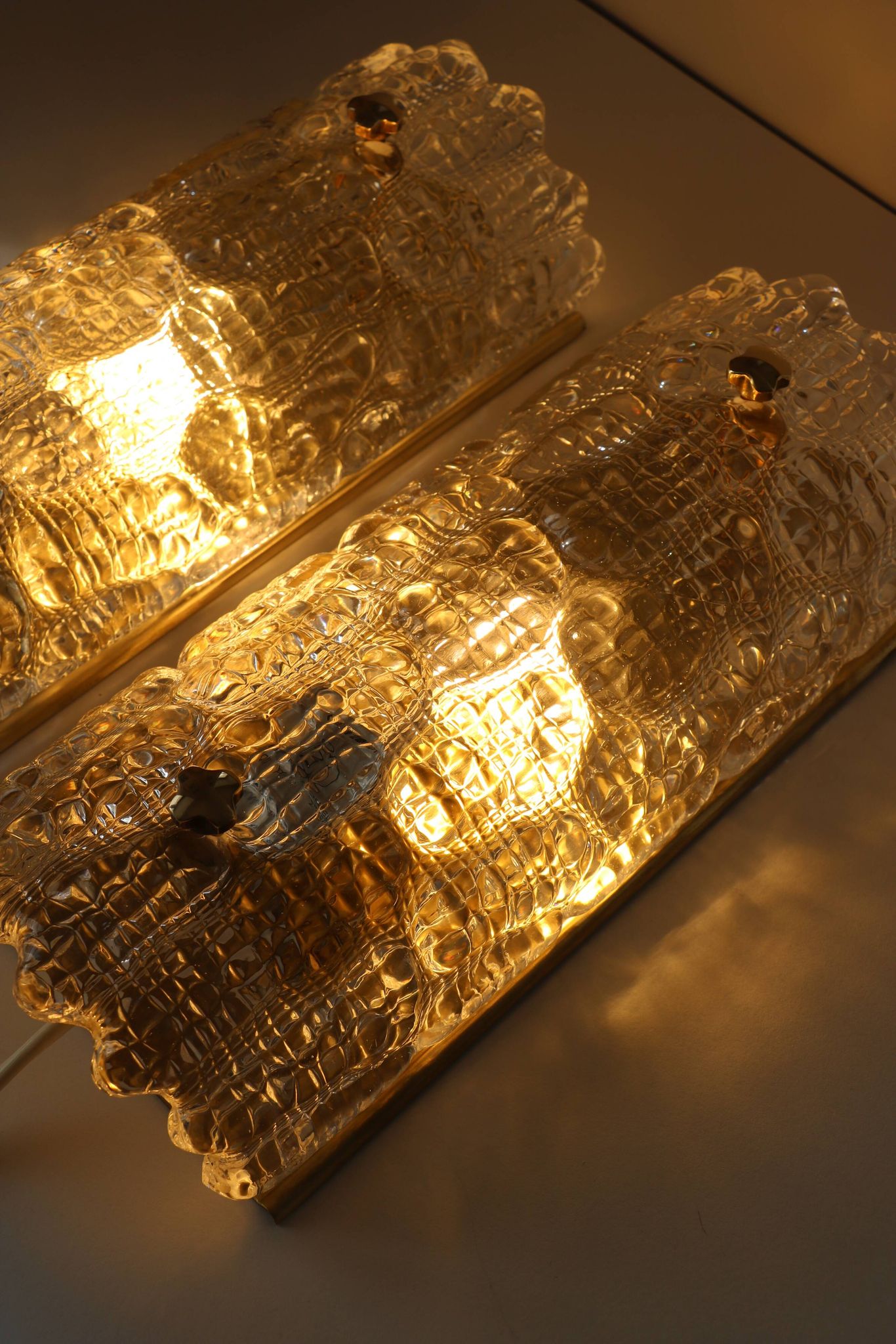 Pair of glass and brass wall lights by Carl Fagerlund for Orrefors, 1960.
