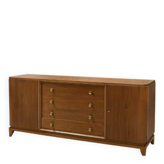 According to André Arbus, a sideboard in a row from the Art Deco period in blonde mahogany.