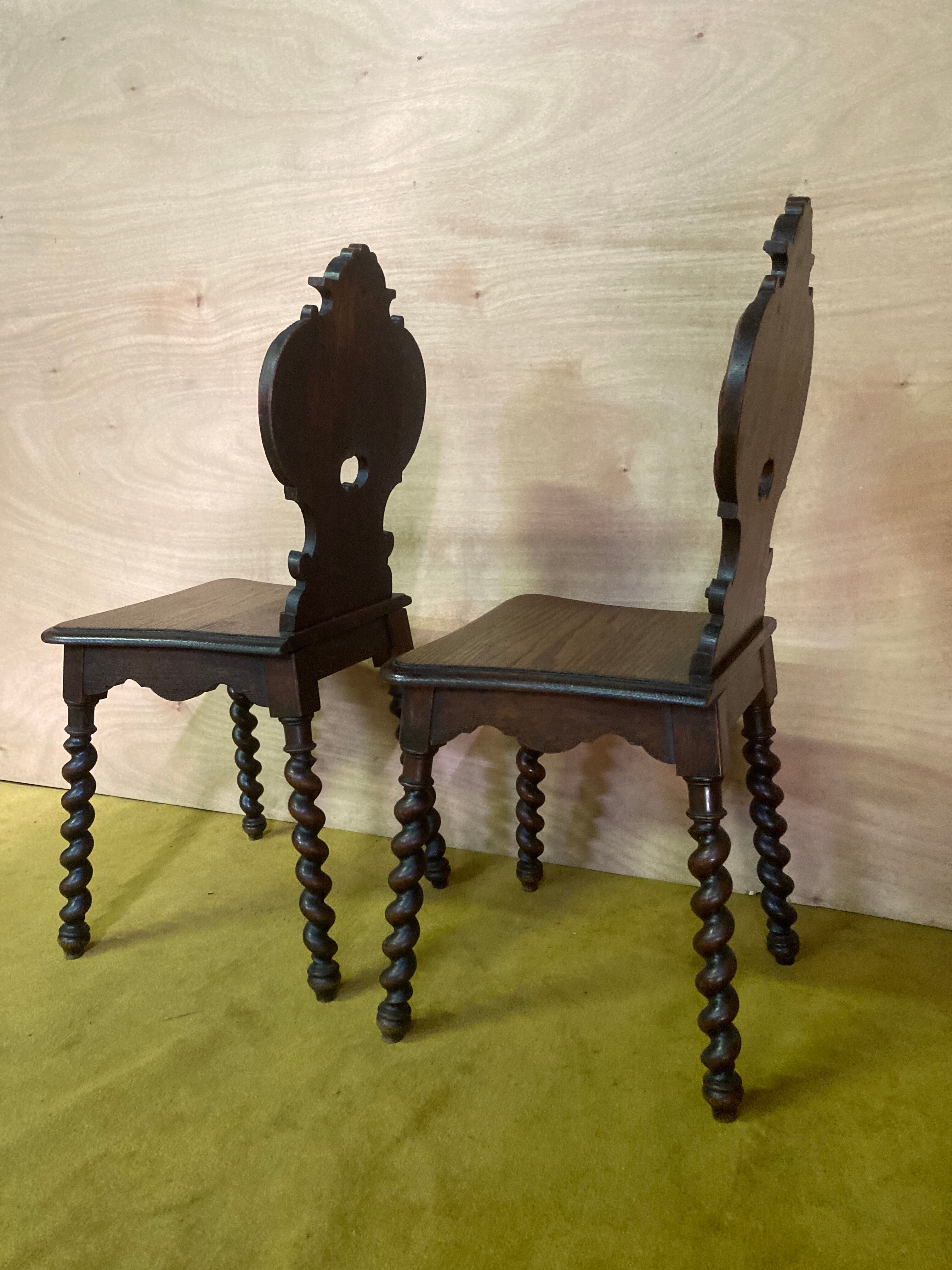 Duo of carved wooden chairs