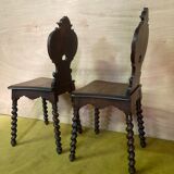 Duo of carved wooden chairs