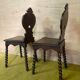 Duo of carved wooden chairs