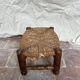 Rustic footrest made of wood and straw