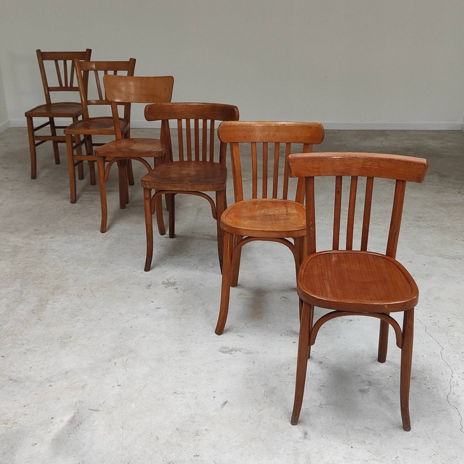 Set of 6 mismatched blond wood bistro chairs