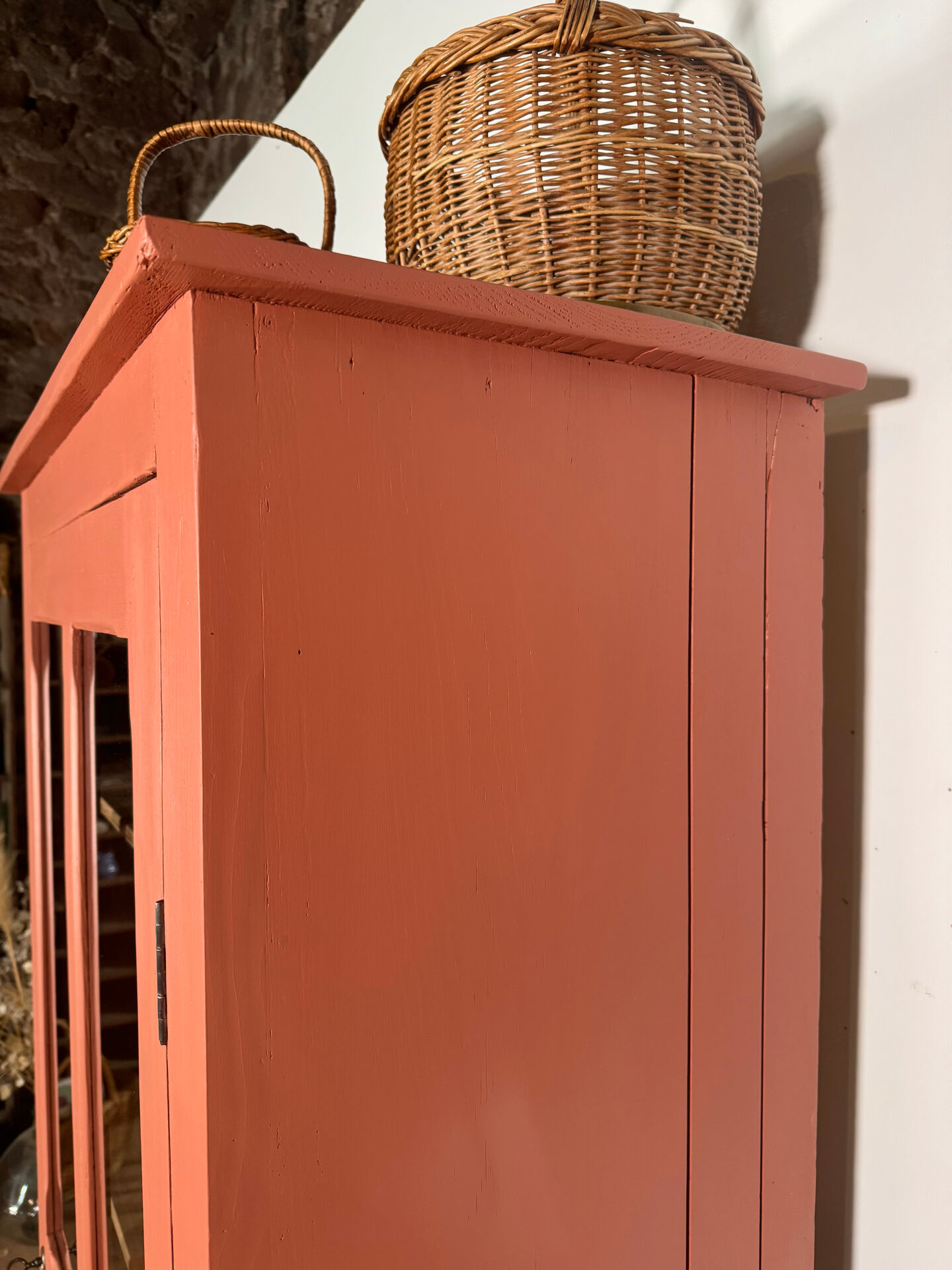 Antique glass-fronted terracotta cupboard